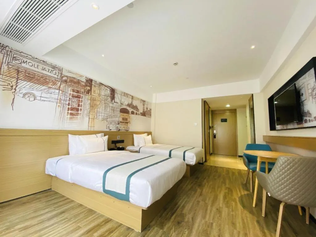 Bed in City Comfort Inn Yancheng Xihuan Road Wanda Plaza