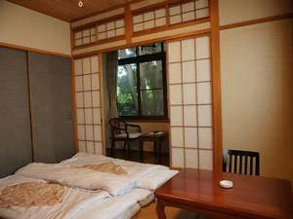 Bed in Hotel Miyoshino Annex