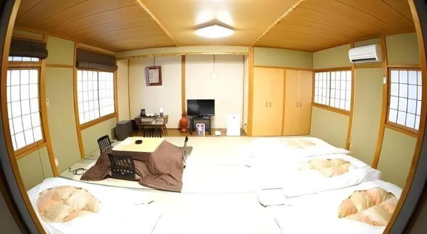 Bed in Hotel Miyoshino Annex