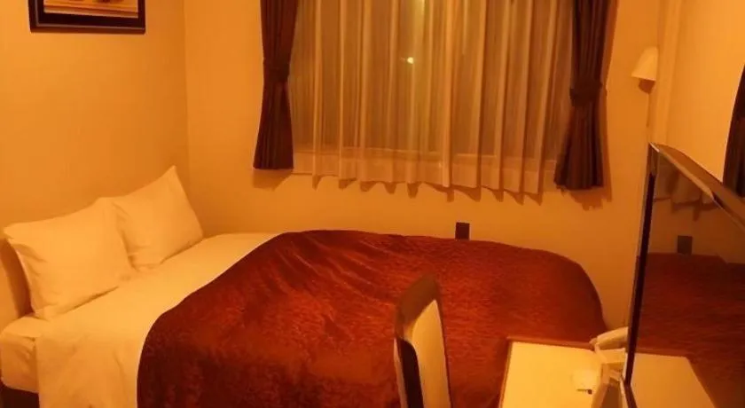 Bed in Hotel Miyoshino Annex