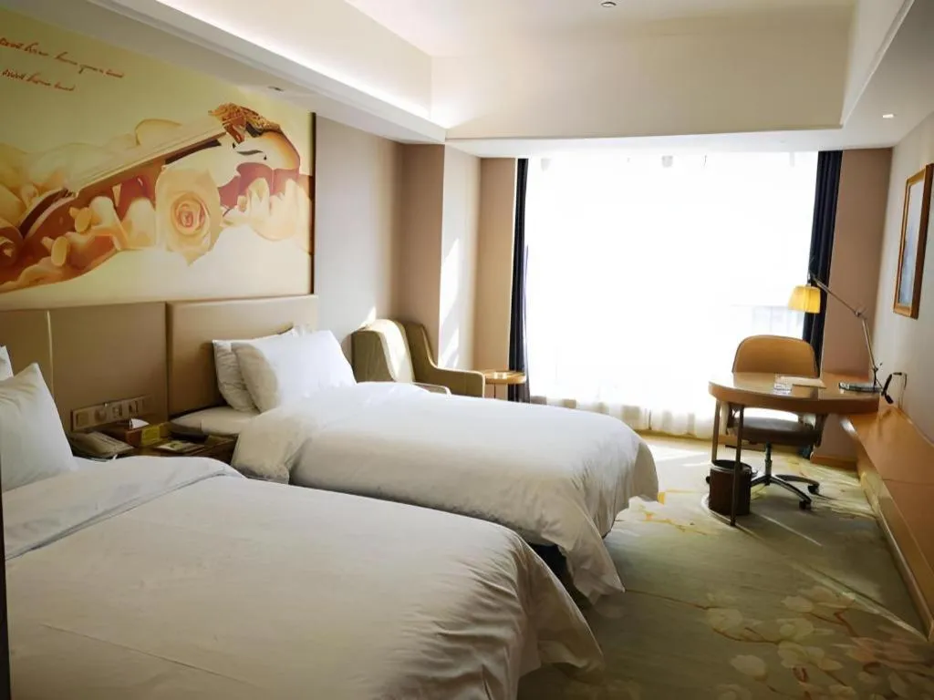 Bed in Vienna Hotel Zhengzhou East High-Speed Railway Station