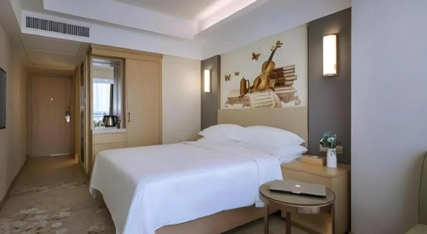 Bed in Vienna Hotel Zhengzhou East High-Speed Railway Station