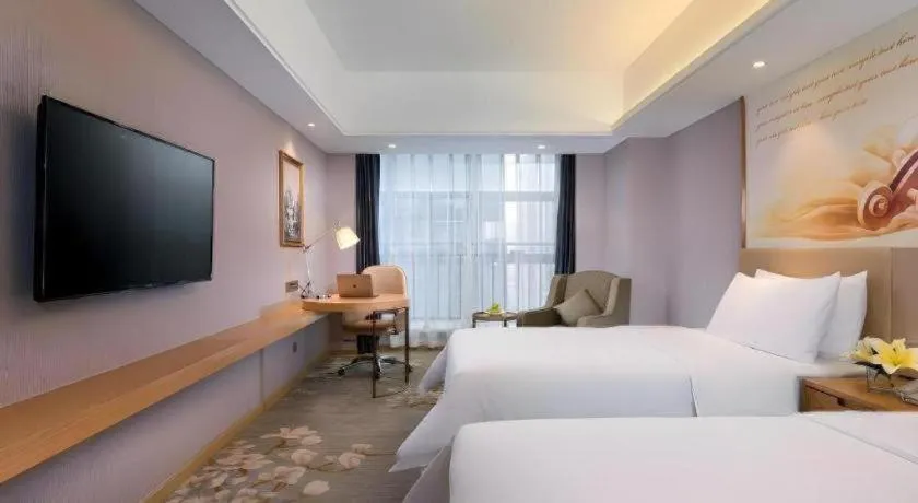 Bed in Vienna Hotel Zhengzhou East High-Speed Railway Station