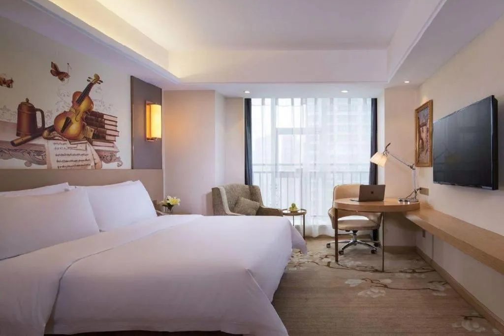 Bed in Vienna Hotel Zhengzhou East High-Speed Railway Station