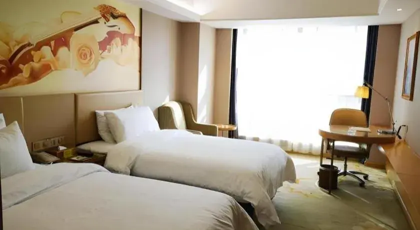 Bed in Vienna Hotel Zhengzhou East High-Speed Railway Station Bed in Vienna Hotel Zhengzhou East High-Speed Railway Station