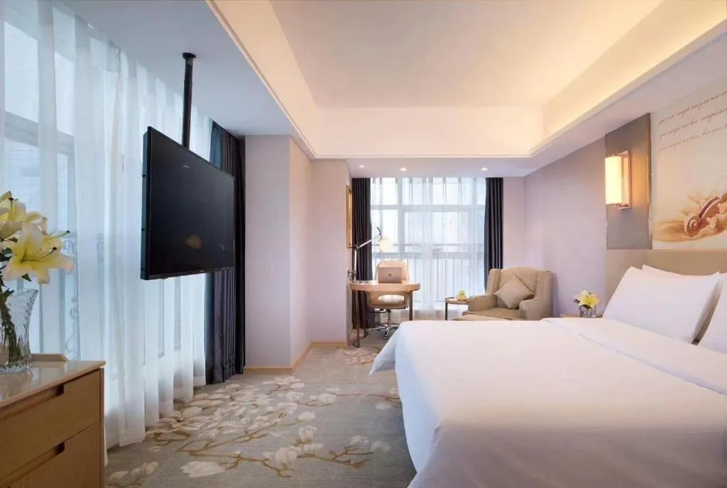 Bed in Vienna Hotel Zhengzhou East High-Speed Railway Station