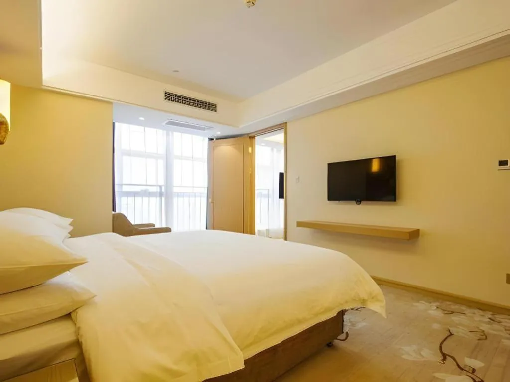 Bed in Vienna Hotel Zhengzhou East High-Speed Railway Station