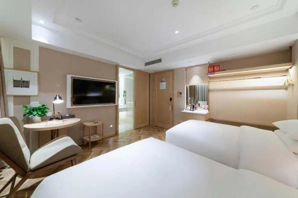 Bed in Vienna Hotel Chongqing West Station Square