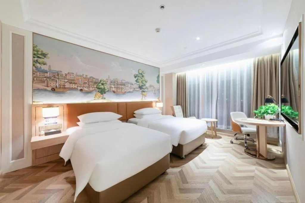 Bed in Vienna Hotel Chongqing West Station Square