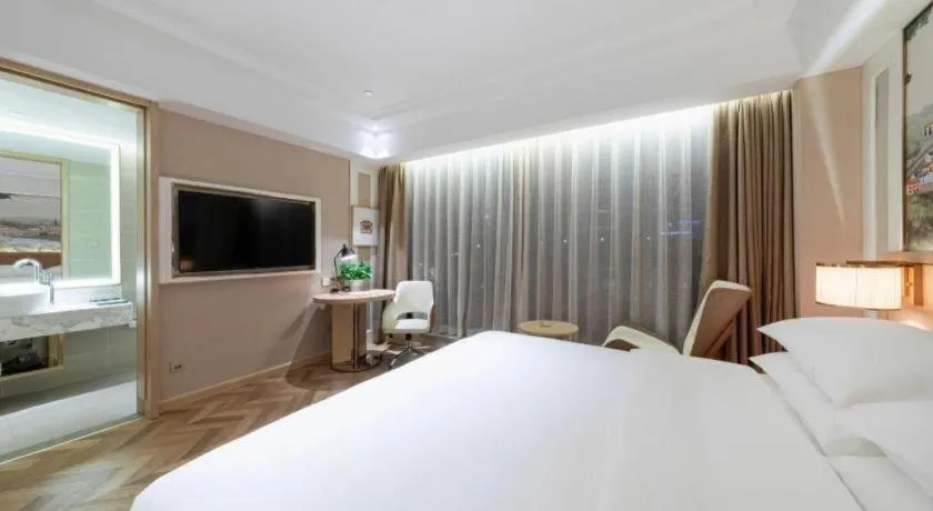 Bed in Vienna Hotel Chongqing West Station Square