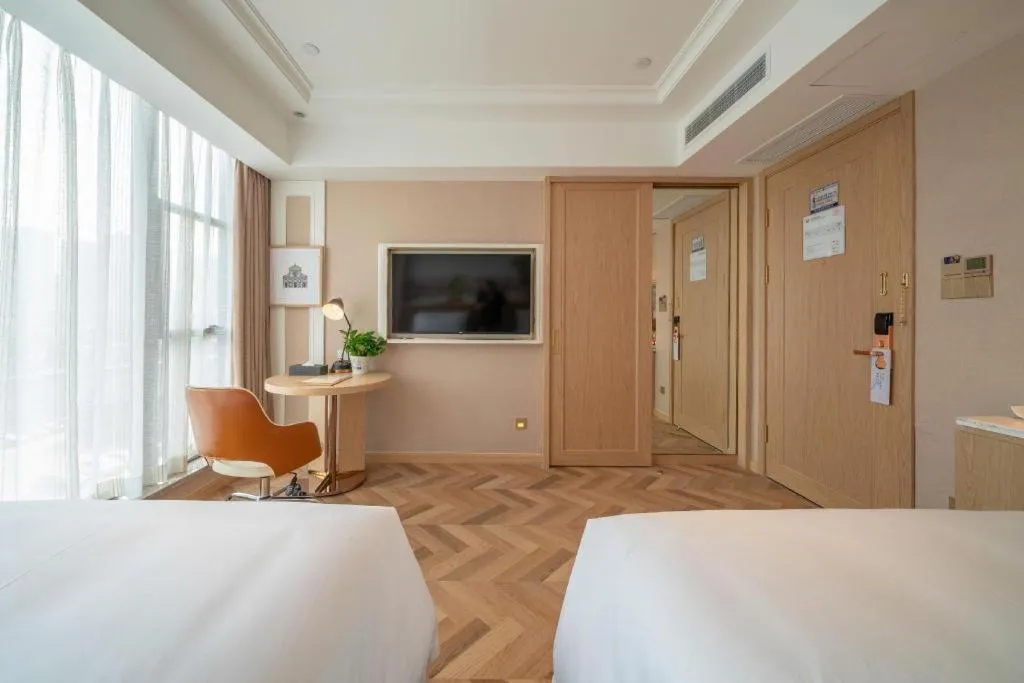 Bed in Vienna Hotel Chongqing West Station Square