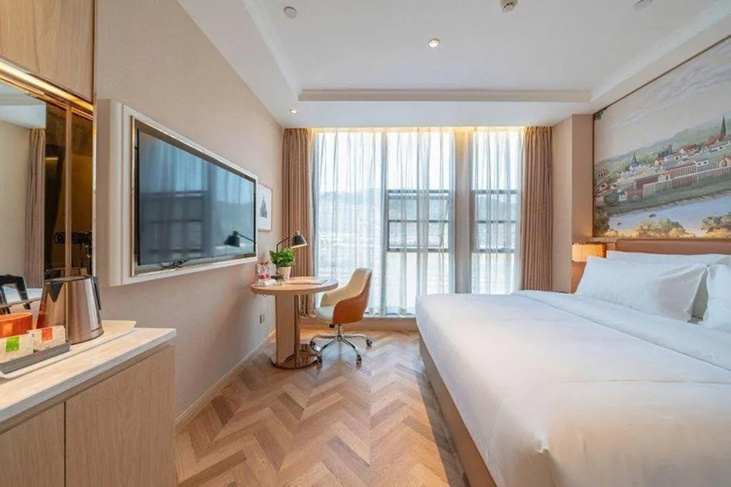 Bed in Vienna Hotel Chongqing West Station Square