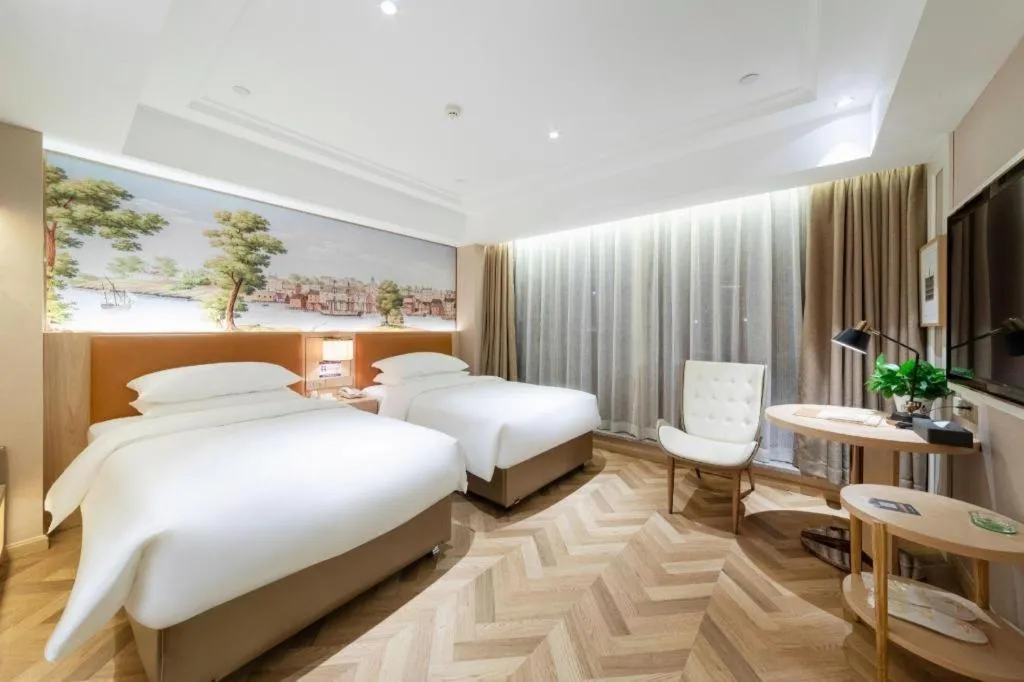 Bed in Vienna Hotel Chongqing West Station Square