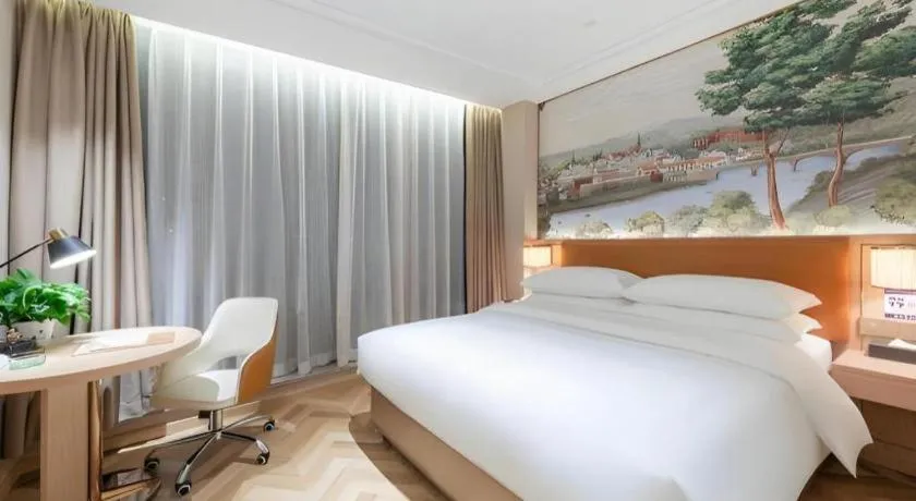 Bed in Vienna Hotel Chongqing West Station Square