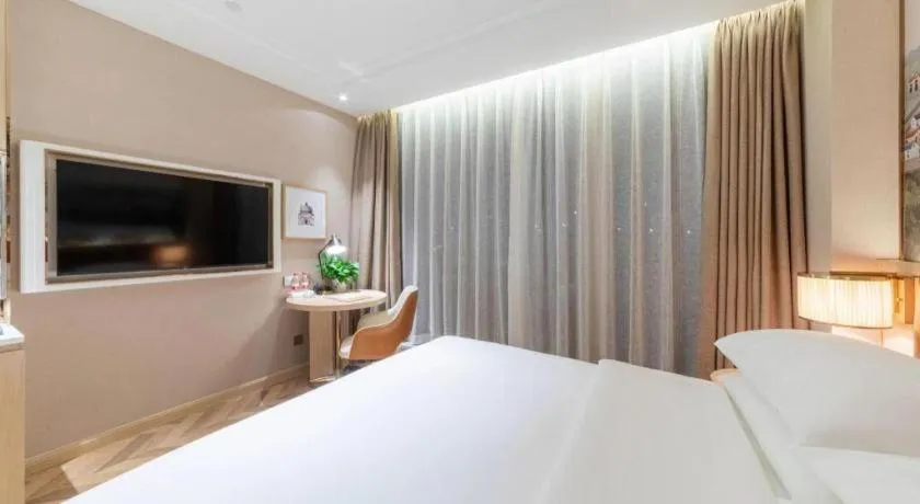 Bed in Vienna Hotel Chongqing West Station Square