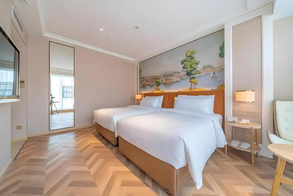 Bed in Vienna Hotel Chongqing West Station Square