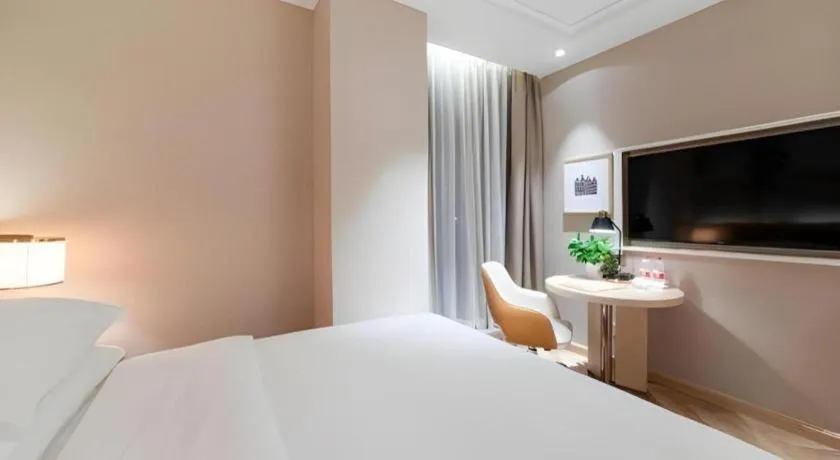 Bed in Vienna Hotel Chongqing West Station Square