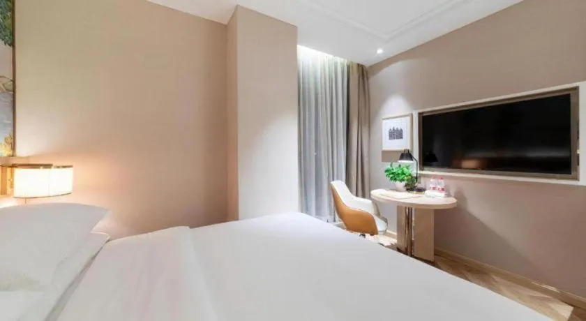 Bed in Vienna Hotel Chongqing West Station Square