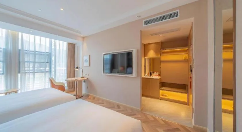 Bed in Vienna Hotel Chongqing West Station Square