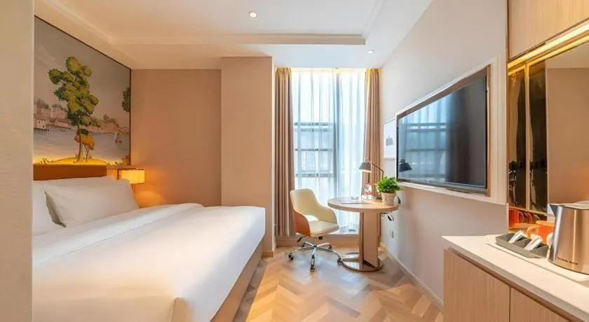 Bed in Vienna Hotel Chongqing West Station Square