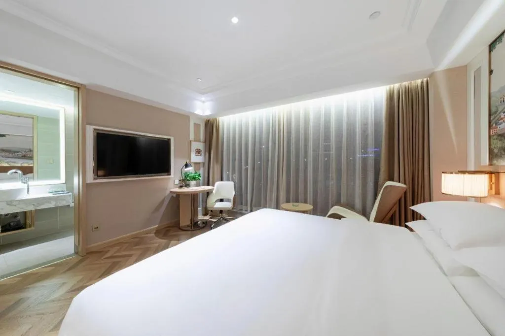 Bed in Vienna Hotel Chongqing West Station Square