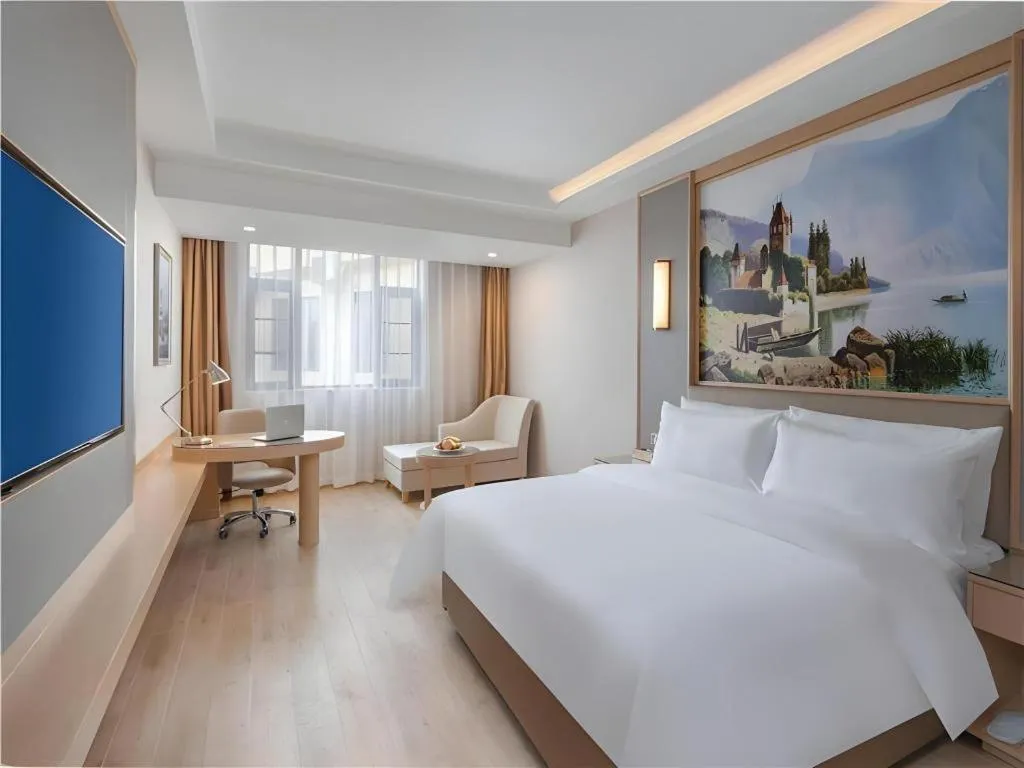 Bed in Vienna Hotel Yuxi Hongta Avenue High-Speed Railway Station