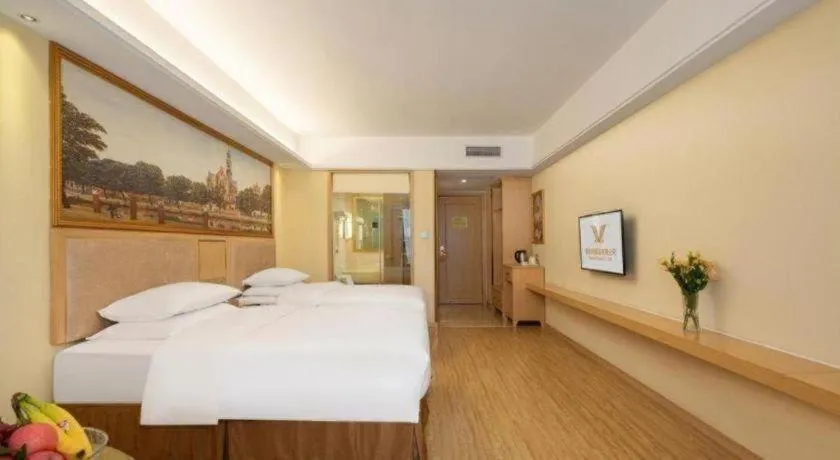 Bed in Vienna Hotel Chongqing Shizhu Stadium