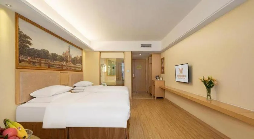 Bed in Vienna Hotel Chongqing Shizhu Stadium