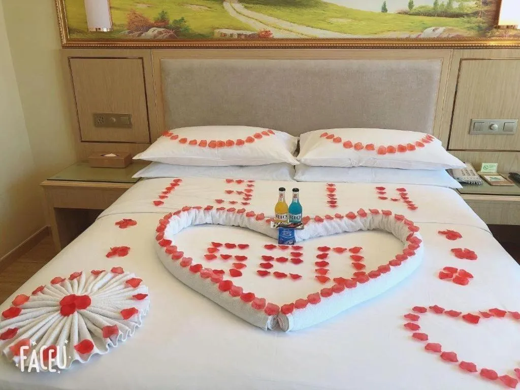 Bed in Vienna Hotel Chongqing Shizhu Stadium