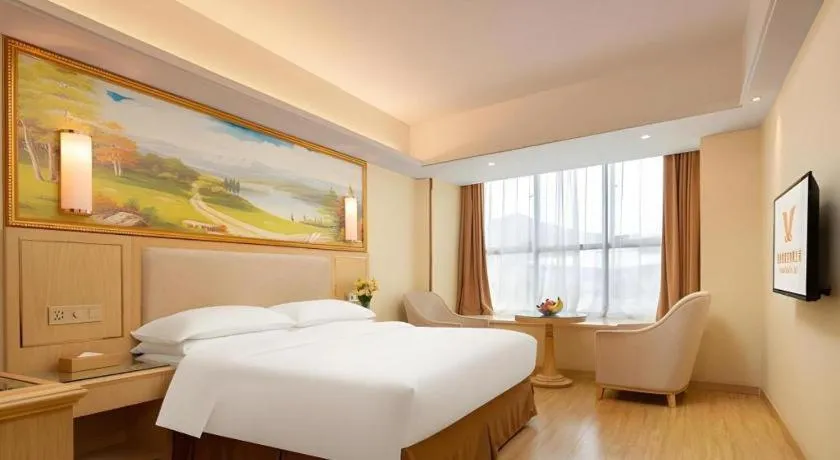 Bed in Vienna Hotel Chongqing Shizhu Stadium