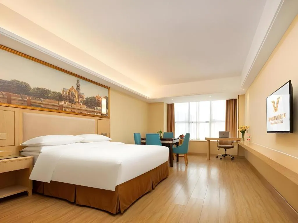 Bed in Vienna Hotel Chongqing Shizhu Stadium