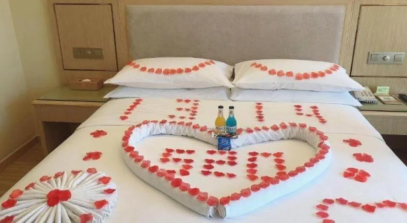 Bed in Vienna Hotel Chongqing Shizhu Stadium