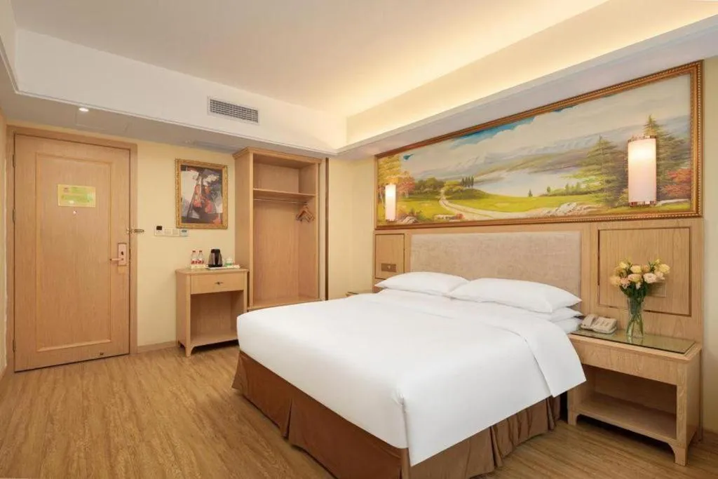 Bed in Vienna Hotel Chongqing Shizhu Stadium