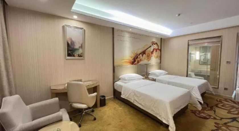 Bed in Vienna Hotel Guangdong Huidong Herung Pedestrian Street