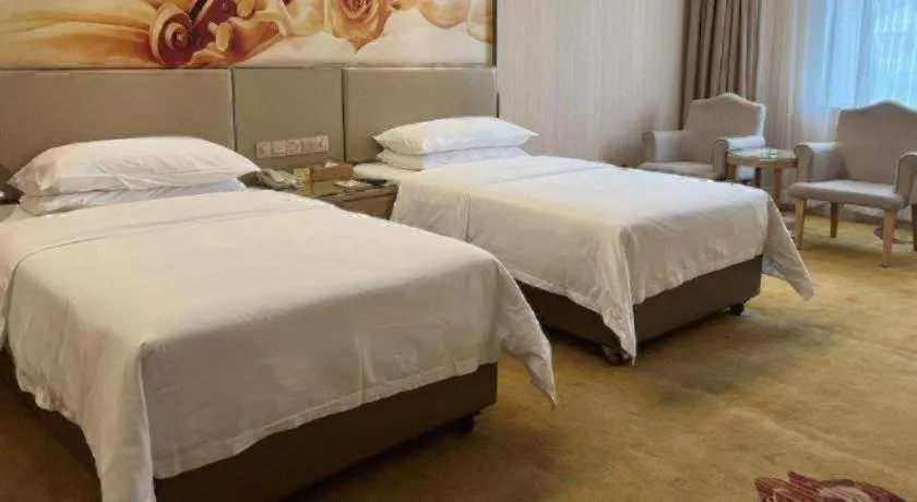 Bed in Vienna Hotel Guangdong Huidong Herung Pedestrian Street