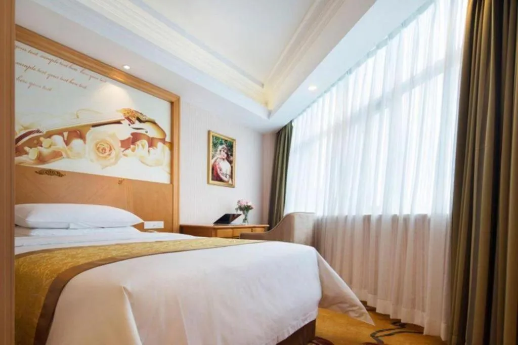 Bed in Vienna Hotel Guangdong Huidong Herung Pedestrian Street