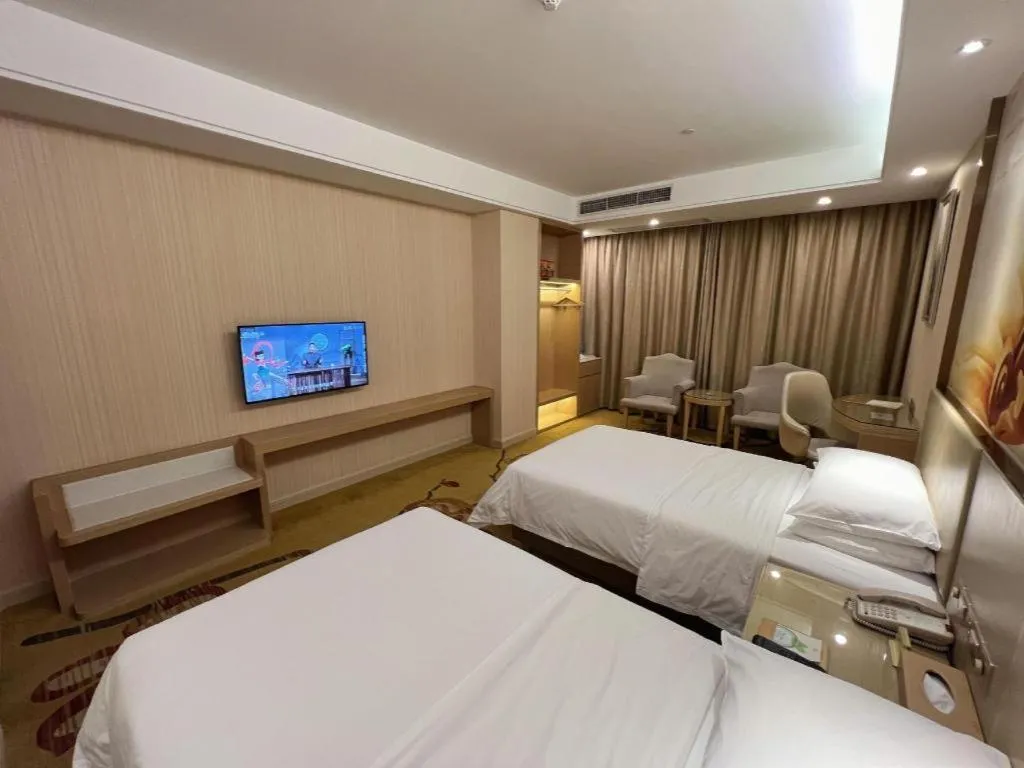Bed in Vienna Hotel Guangdong Huidong Herung Pedestrian Street