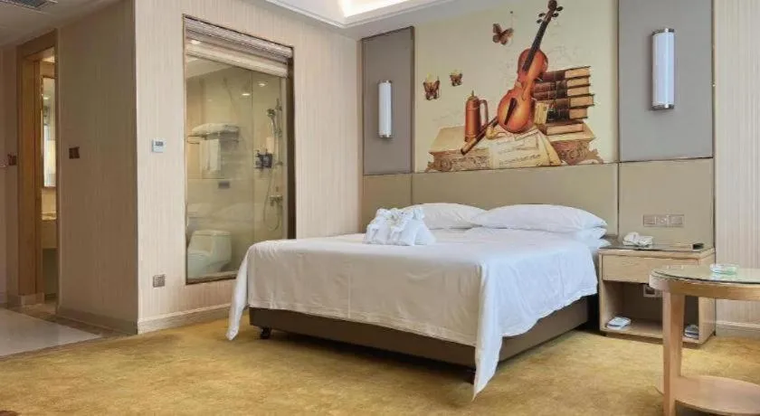 Bed in Vienna Hotel Guangdong Huidong Herung Pedestrian Street