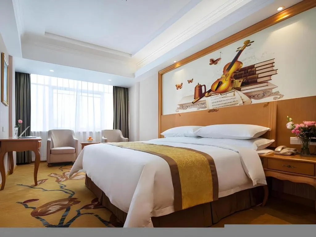 Bed in Vienna Hotel Guangdong Huidong Herung Pedestrian Street