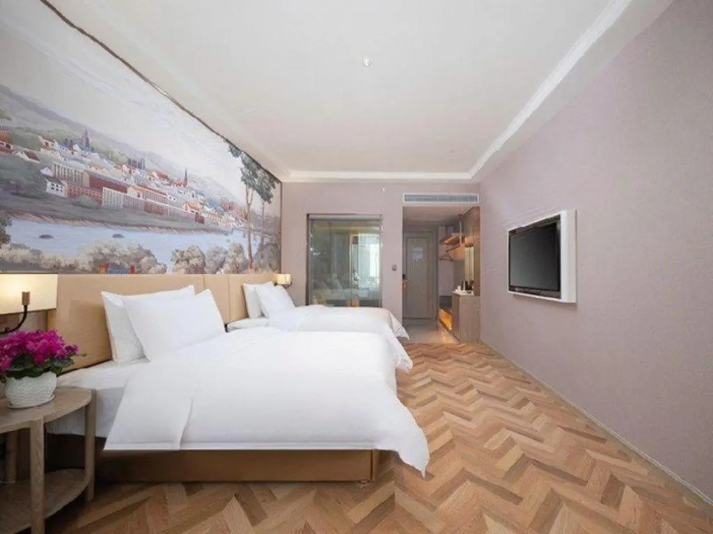 Bed in Vienna Hotel Lincang New Asia Pacific Times Square