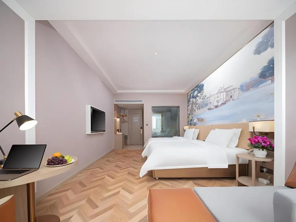 Bed in Vienna Hotel Lincang New Asia Pacific Times Square