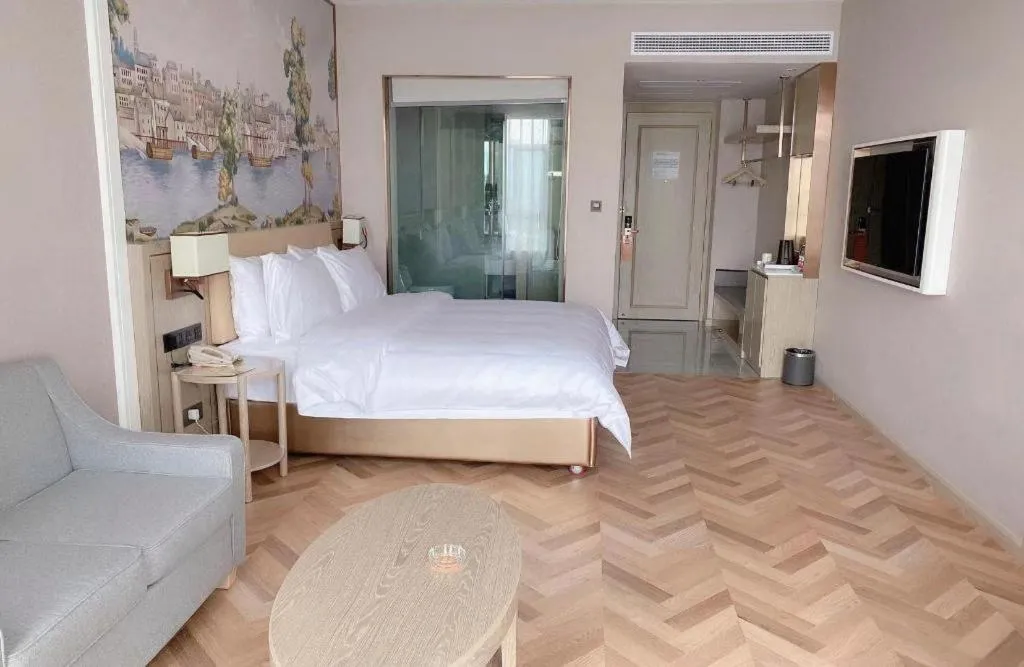 Bed in Vienna Hotel Lincang New Asia Pacific Times Square