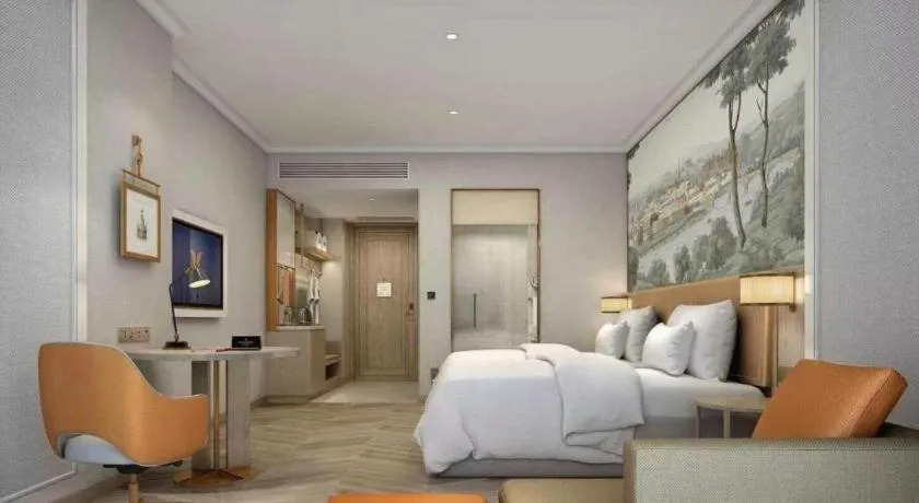 Bed in Vienna Hotel Lincang New Asia Pacific Times Square