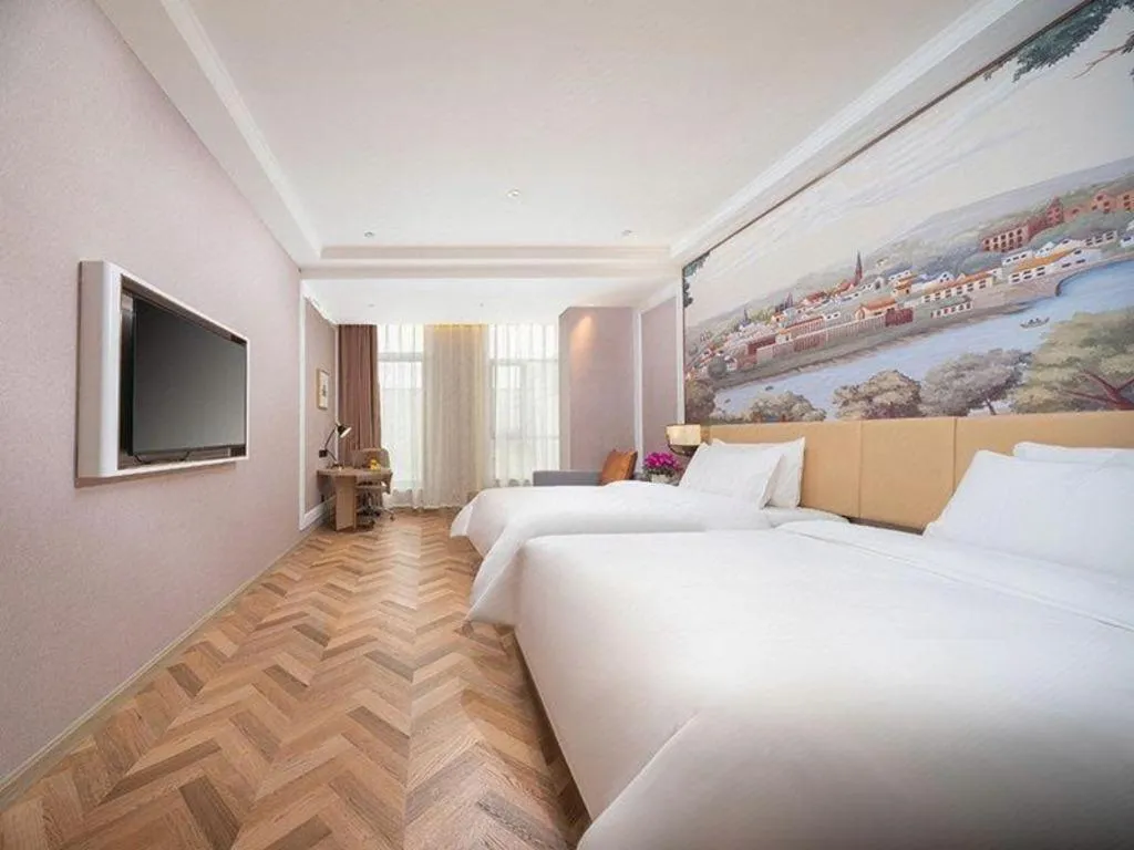 Bed in Vienna Hotel Lincang New Asia Pacific Times Square