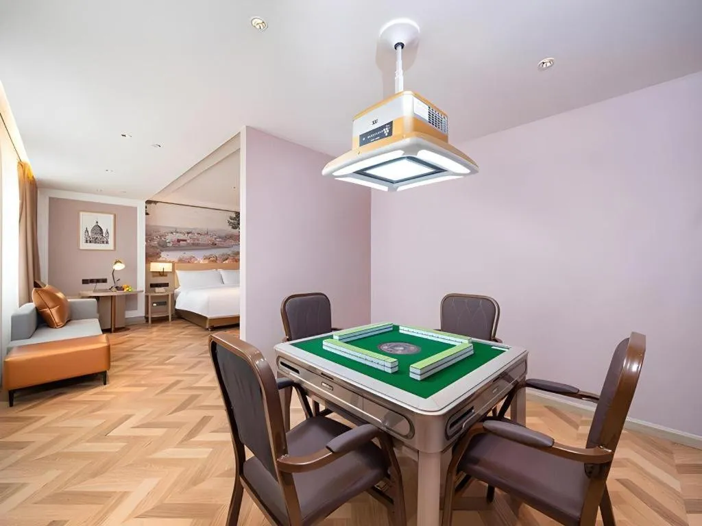 Bed in Vienna Hotel Lincang New Asia Pacific Times Square