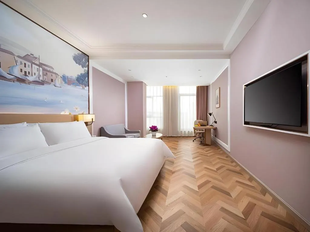 Bed in Vienna Hotel Lincang New Asia Pacific Times Square