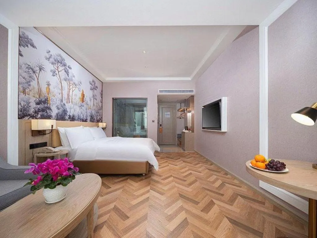 Bed in Vienna Hotel Lincang New Asia Pacific Times Square