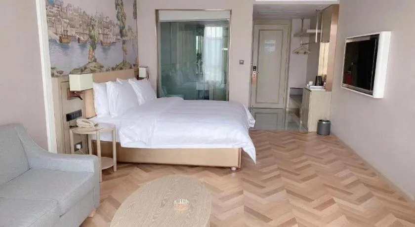 Bed in Vienna Hotel Lincang New Asia Pacific Times Square