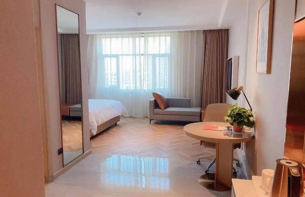 Bed in Vienna Hotel Lincang New Asia Pacific Times Square