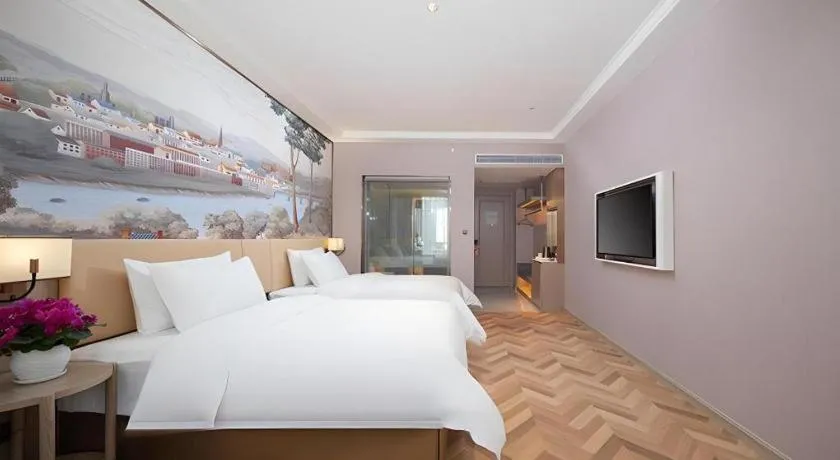 Bed in Vienna Hotel Lincang New Asia Pacific Times Square